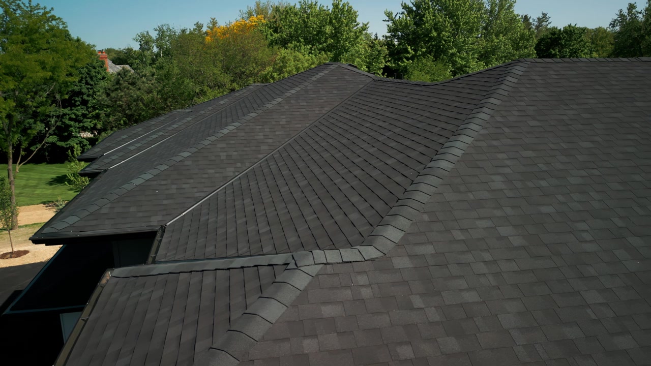 Aerial view over a newly installed composition shingle roof